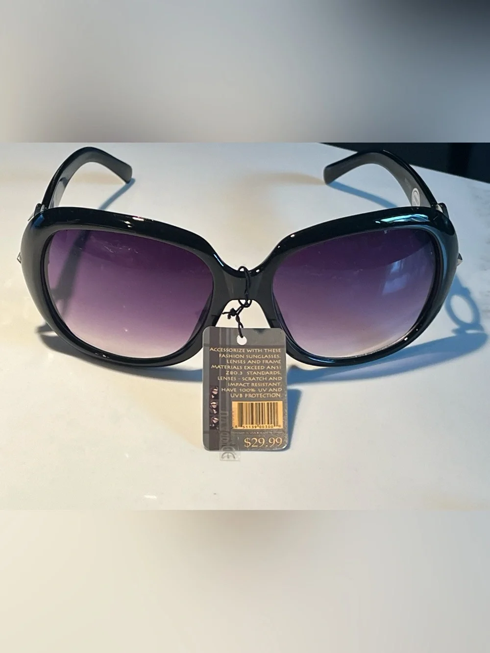 NWT fabulous oversized black sunglasses with violet lenses.